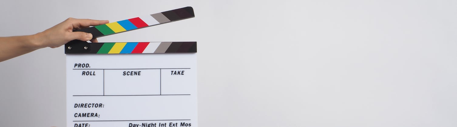 A set of hands holding a clipboard open.
